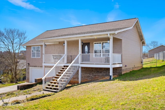 view of front facade featuring roof with shingles, covered porch, stairway, a garage, and a front lawn