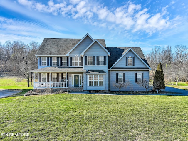 view of front facade featuring a porch and a front yard