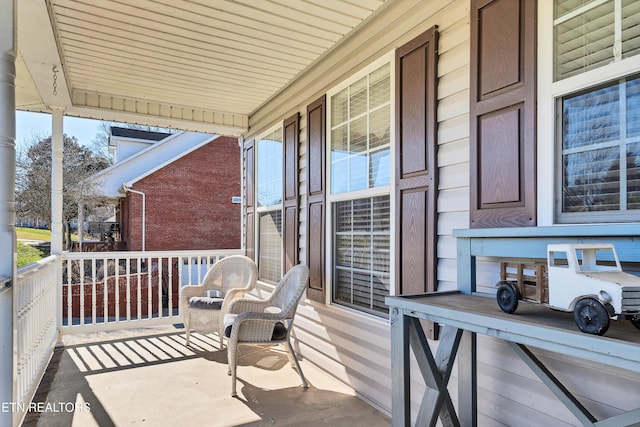 balcony featuring a porch