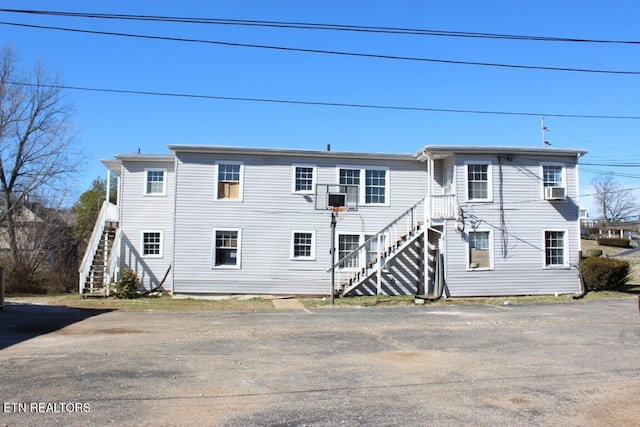 view of front of home with stairs