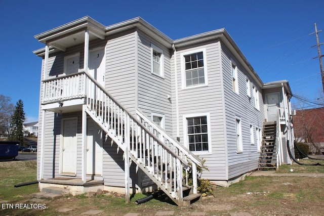 back of house with stairway