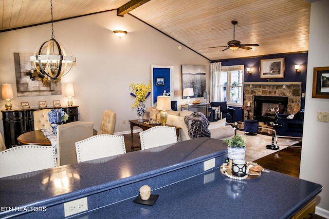 10 Dockside Dr, Crossville, TN 38558 - living room featuring ceiling fan with notable chandelier, wood finished floors, a stone fireplace, wood ceiling, and vaulted ceiling with beams