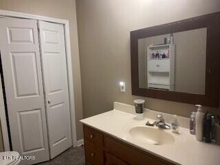 bathroom with toilet and vanity