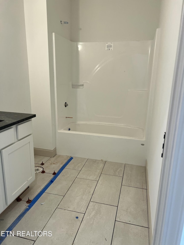 bathroom with vanity and shower / bathing tub combination