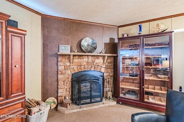 living room with crown molding, a textured ceiling, carpet flooring, and a stone fireplace