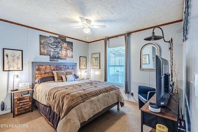 bedroom featuring ornamental molding, light carpet, a textured ceiling, and a ceiling fan