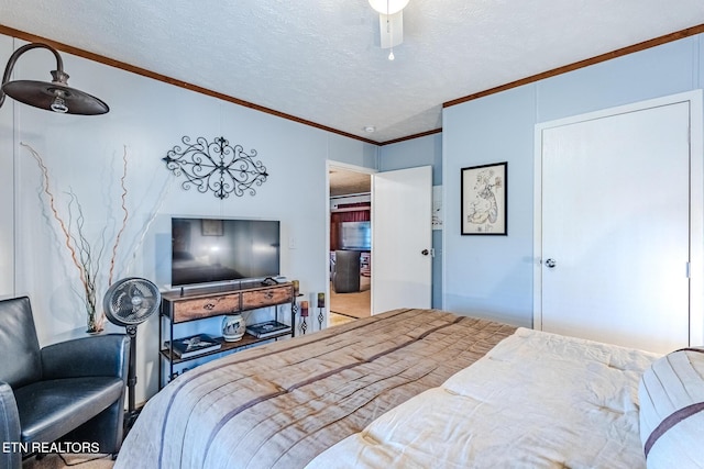 bedroom featuring a textured ceiling, ceiling fan, and crown molding