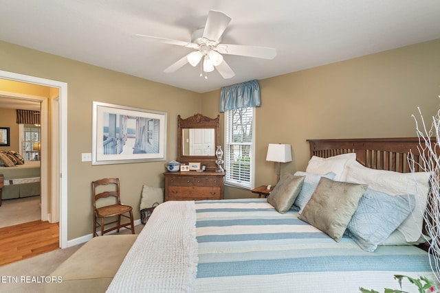 bedroom featuring a ceiling fan and baseboards