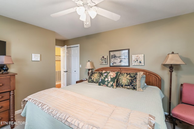 bedroom featuring a closet, baseboards, ceiling fan, and carpet floors