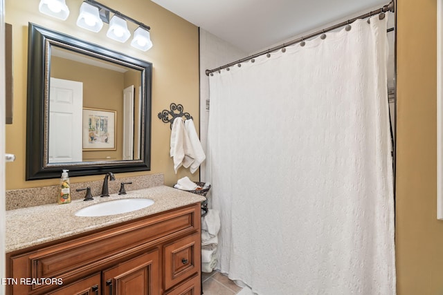 bathroom with vanity and tile patterned flooring