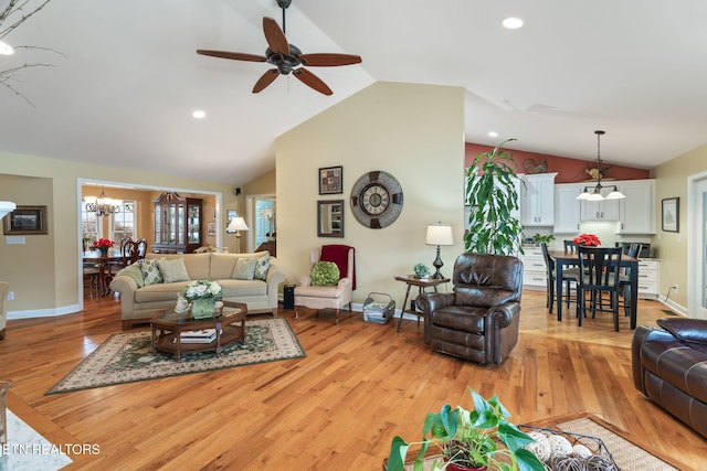 living room with recessed lighting, light wood-style flooring, and baseboards