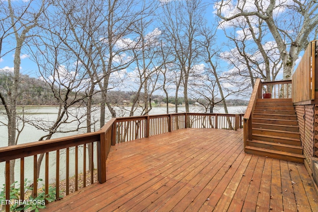 wooden deck featuring a water view