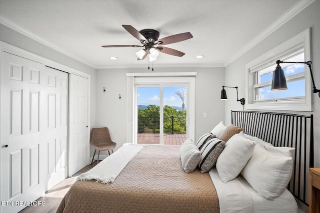 bedroom with access to exterior, ornamental molding, light wood finished floors, and a closet