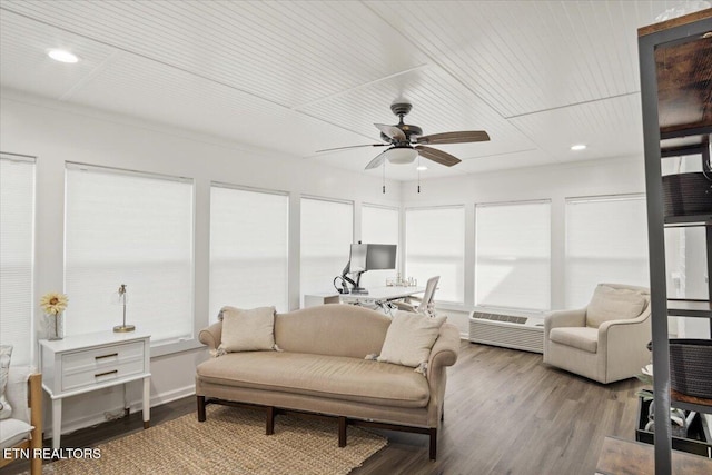 sunroom / solarium with a ceiling fan and a wall mounted air conditioner