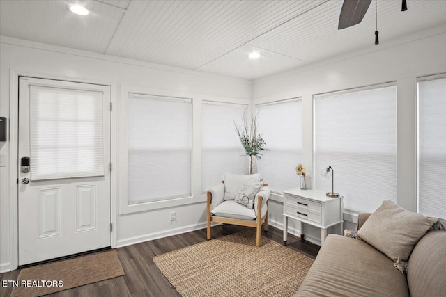 living area with baseboards, dark wood finished floors, a ceiling fan, and recessed lighting