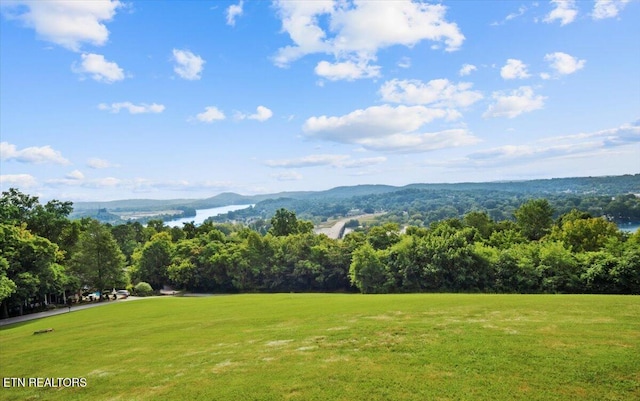 exterior space featuring a forest view