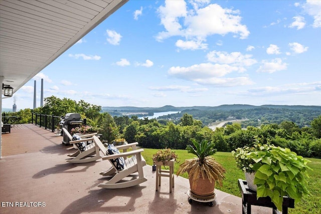 view of patio featuring a grill and a mountain view