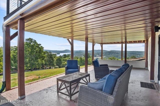 view of patio featuring an outdoor hangout area and a mountain view