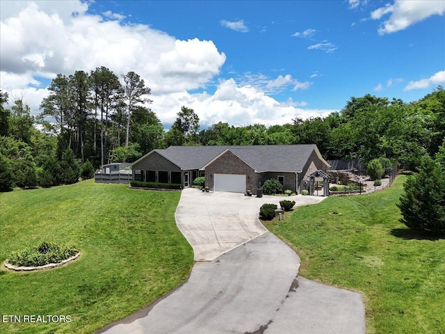 846 Quietlands Dr, Maryville, TN 37801 - ranch-style home with concrete driveway, a garage, a front yard, and view of wooded area