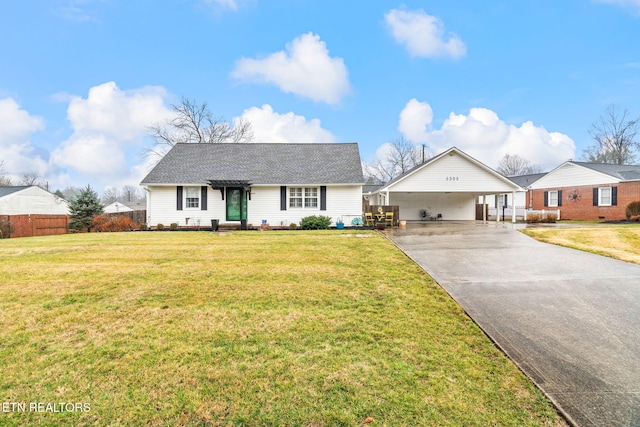 single story home with a carport, driveway, a front lawn, and fence