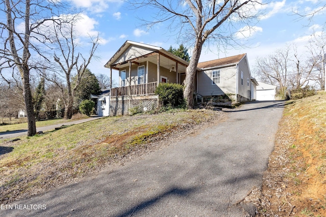 view of front of house with a garage and covered porch