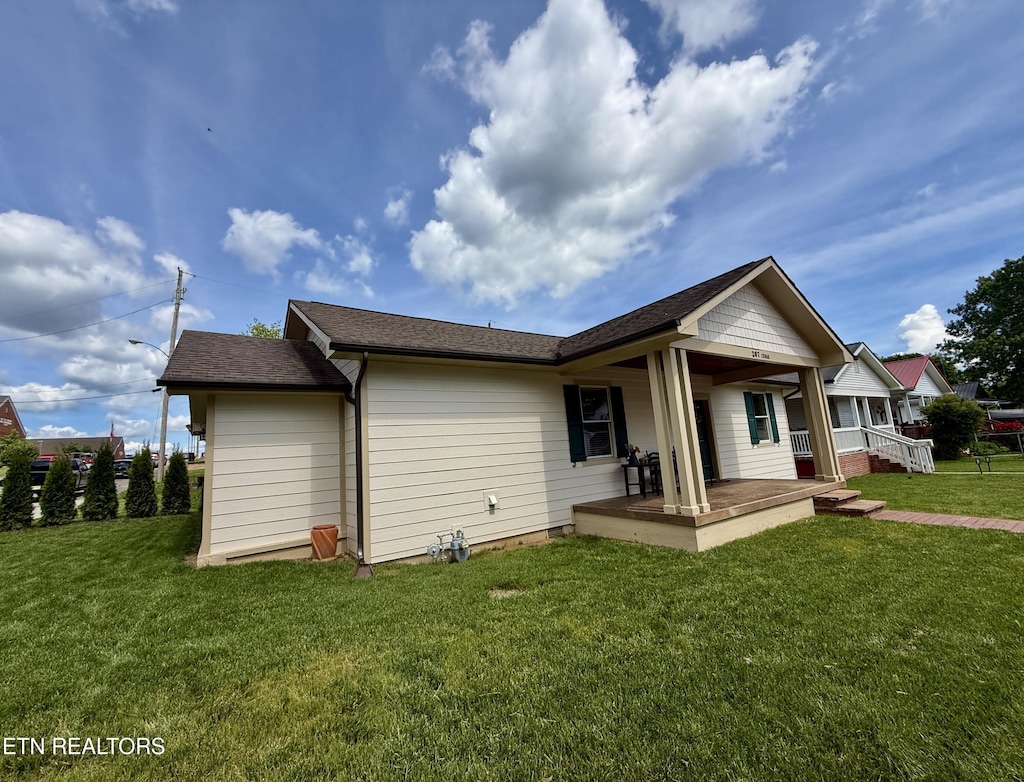207 Cedar St, Loudon, TN 37774 - rear view of house featuring a porch and a yard