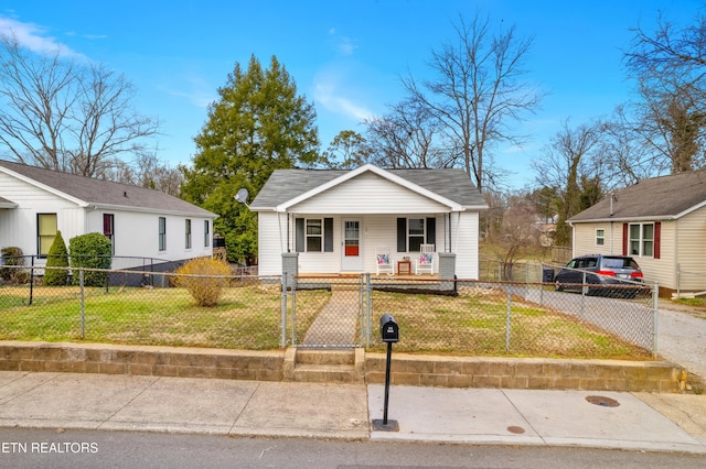 bungalow featuring a porch, a front yard, a gate, and a fenced front yard