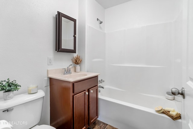 full bathroom with vanity, shower / tub combination, and toilet