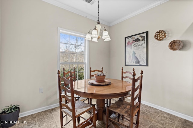 dining space with crown molding, baseboards, and an inviting chandelier