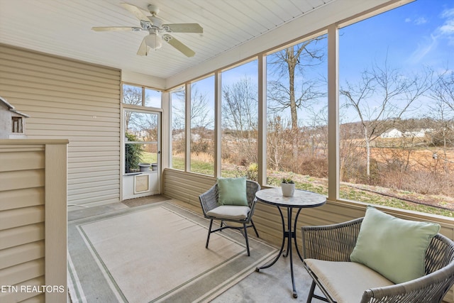 sunroom with a ceiling fan