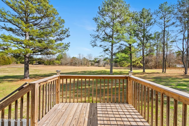 wooden terrace with a yard