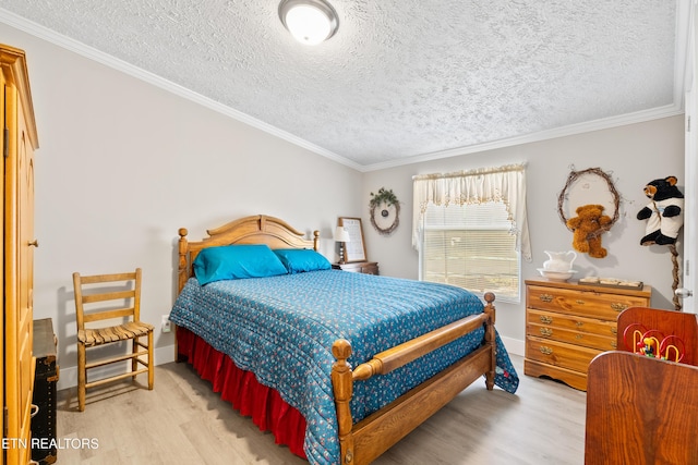 bedroom featuring a textured ceiling, ornamental molding, and wood finished floors