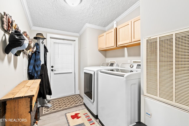 laundry room with ornamental molding, independent washer and dryer, cabinet space, light wood finished floors, and a heating unit