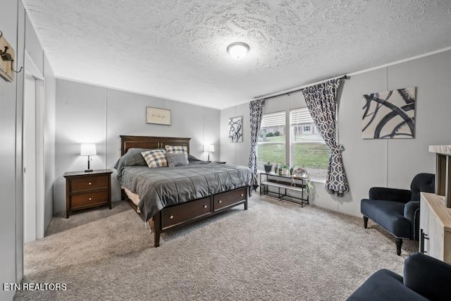 carpeted bedroom featuring a textured ceiling