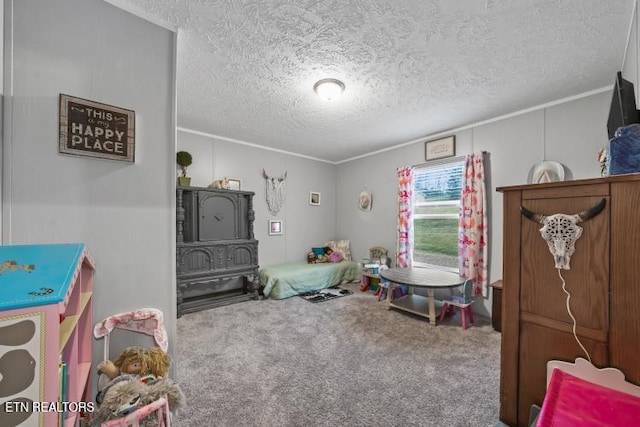 bedroom with carpet floors and a textured ceiling