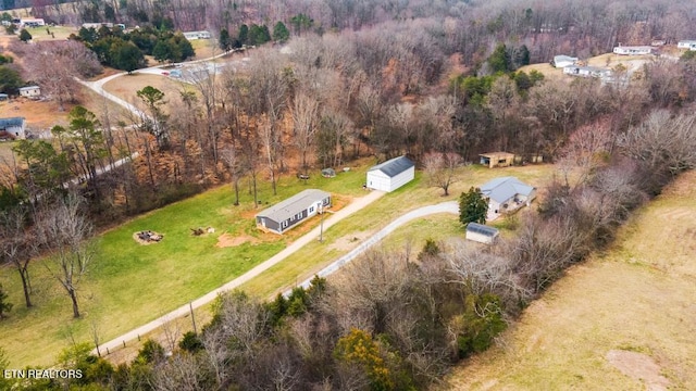 birds eye view of property with a forest view