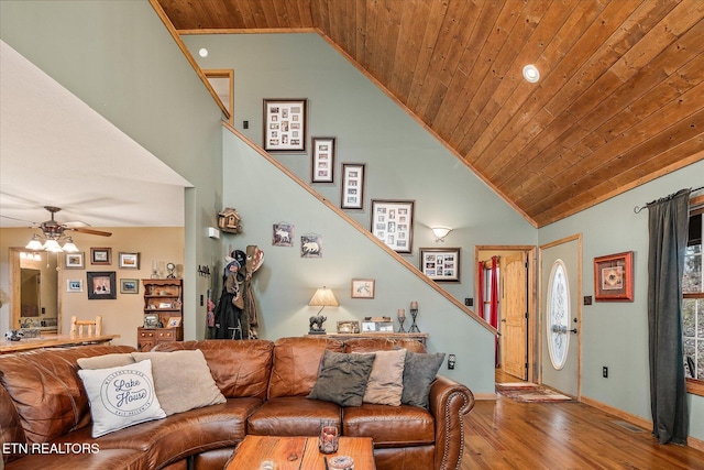 living area featuring high vaulted ceiling, wooden ceiling, a ceiling fan, light wood-style floors, and stairs