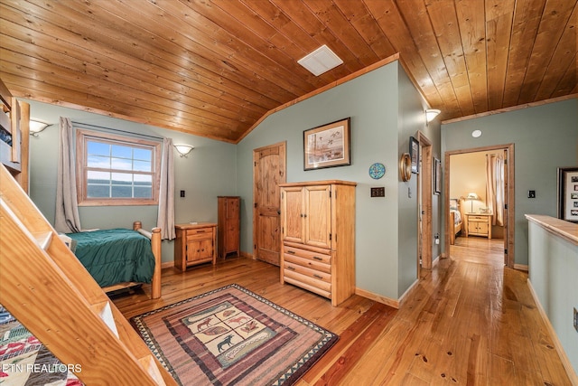 bedroom featuring lofted ceiling, wooden ceiling, light wood-type flooring, and baseboards