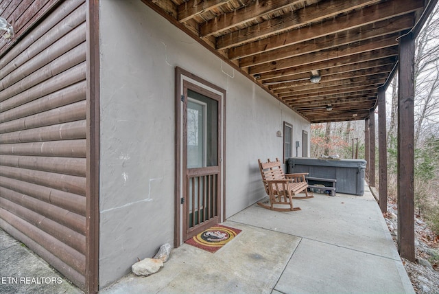 view of patio featuring a hot tub