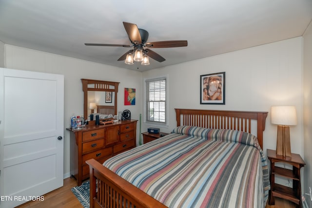 bedroom featuring light wood-style flooring and ceiling fan