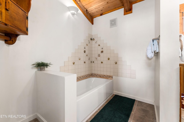 full bathroom featuring wood ceiling, tile patterned flooring, beamed ceiling, baseboards, and a bath