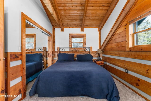 carpeted bedroom with wooden ceiling, beam ceiling, and wooden walls