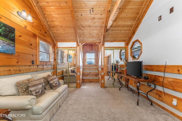 living area with wooden ceiling, light carpet, vaulted ceiling with beams, and wooden walls