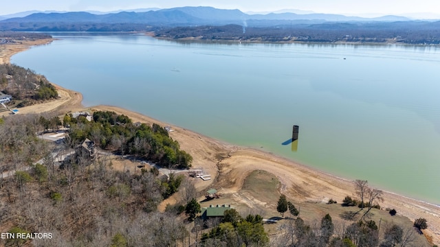 aerial view featuring a water and mountain view