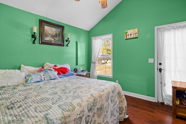 bedroom featuring lofted ceiling, dark wood-style floors, ceiling fan, and baseboards