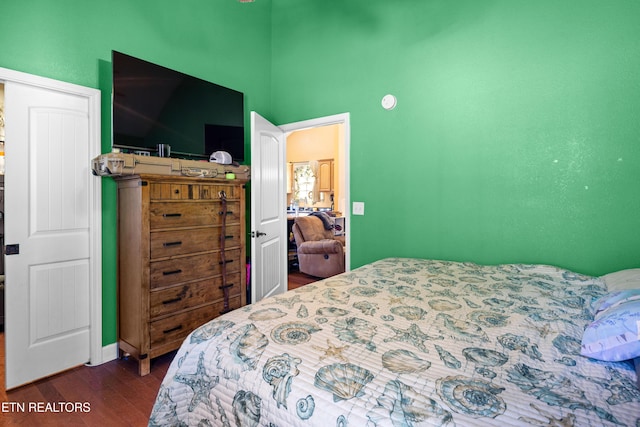 bedroom with wood finished floors