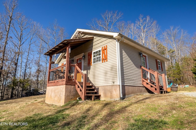 view of side of home featuring a yard