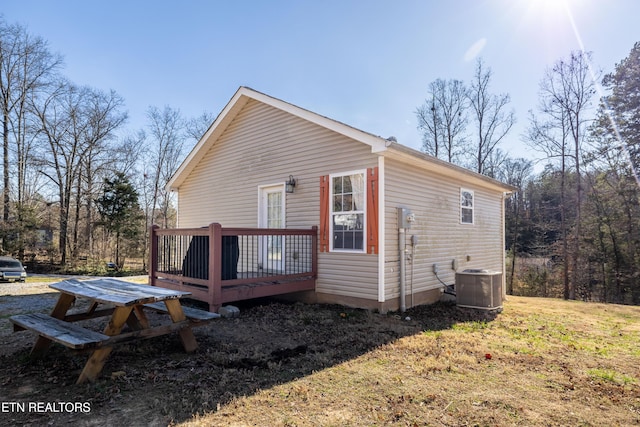 exterior space with a deck and central air condition unit