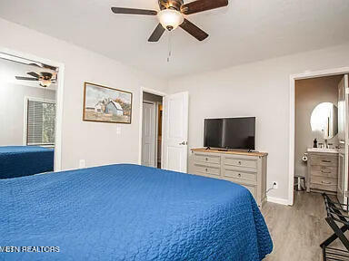 bedroom with baseboards, ceiling fan, and light wood finished floors