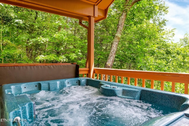 deck with a hot tub